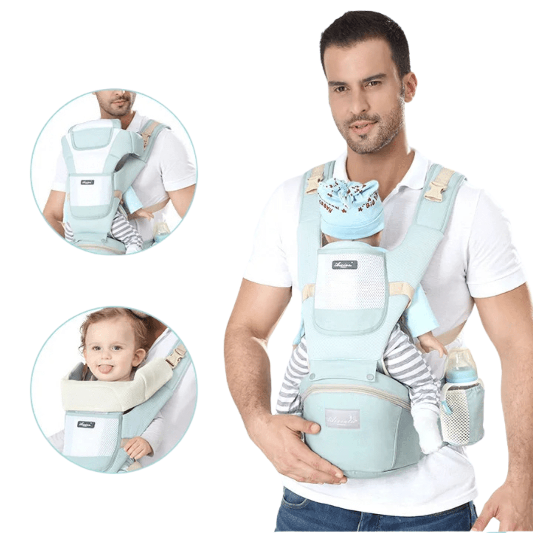 Papa trägt Kleinkind vorwärtsgerichtet in Freya Babytrage mint am Strand