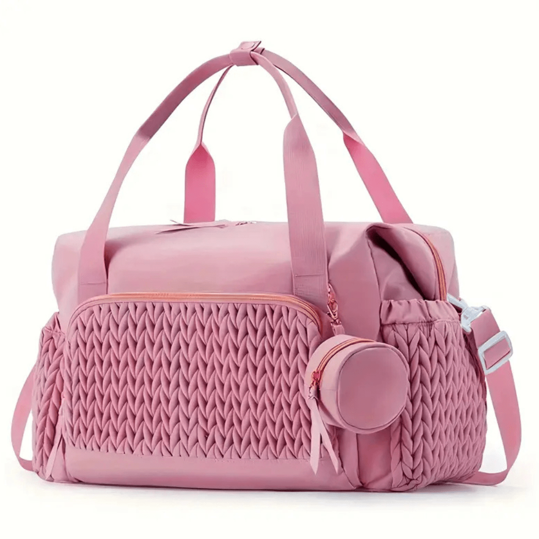 Nada Wickeltasche in Rosé – Frontansicht mit geflochtenem Detail
