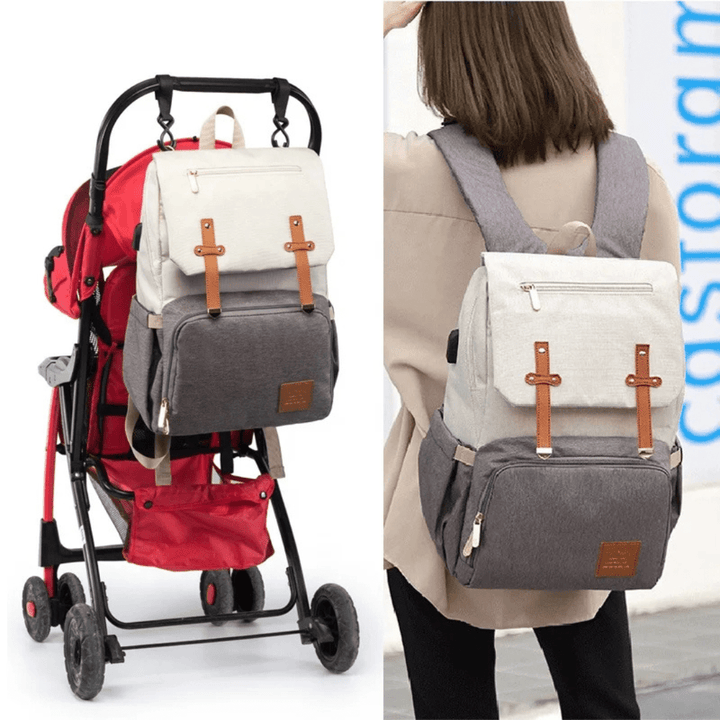 On-the-go: Mutter trägt Robby Rucksack & schiebt Kinderwagen