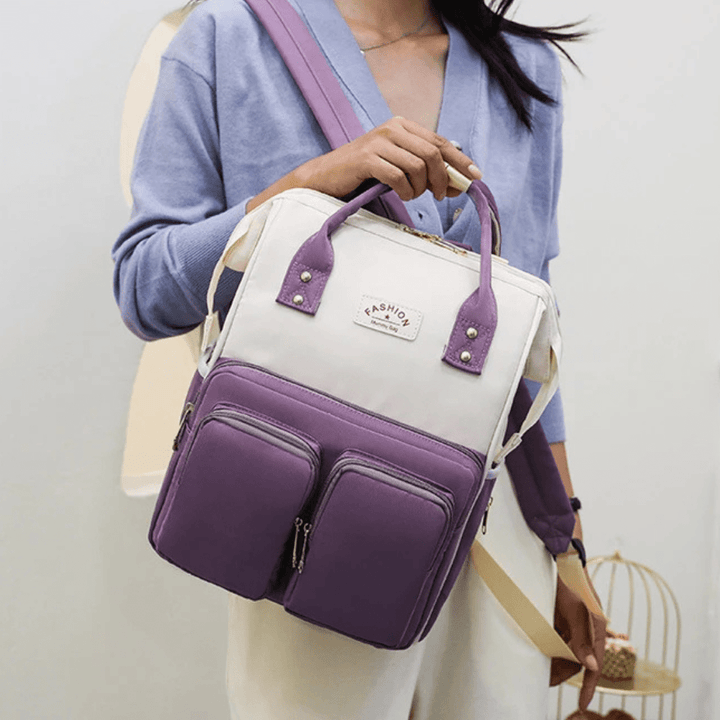 Person traegt lila Tebby Wickelrucksack