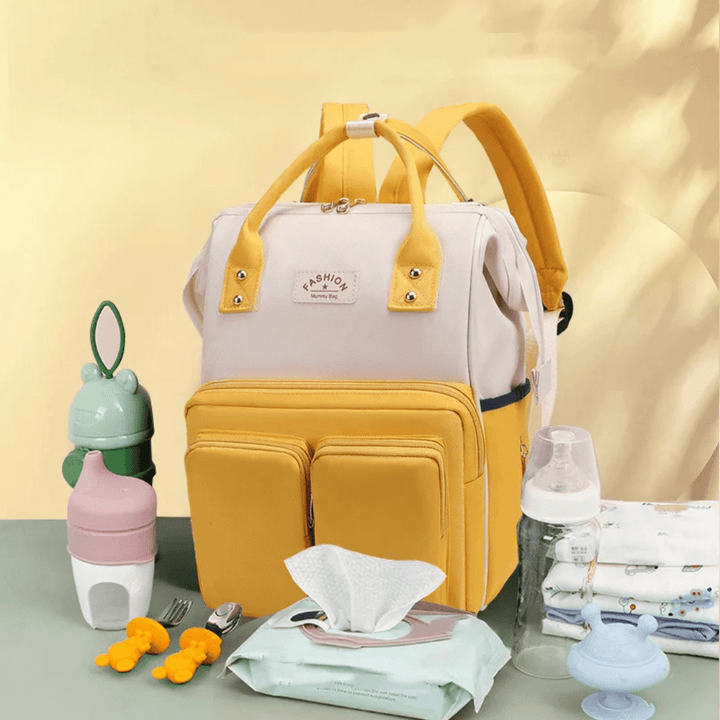 Gelber Tebby Wickelrucksack mit windelorganisation