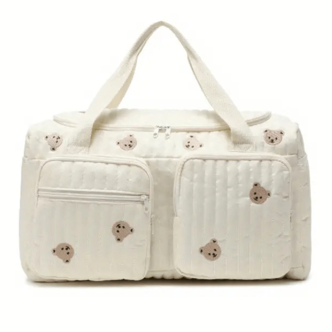 Willow Wickeltasche – Cremefarben, Vorderansicht mit gesteppten Herzen & Fronttaschen